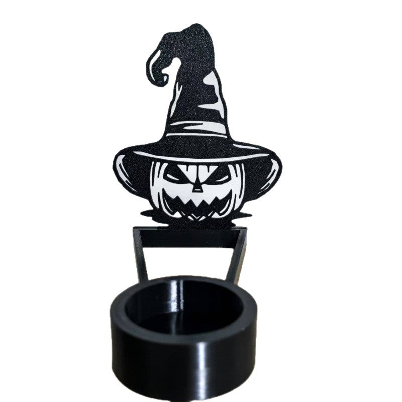 Black Halloween shadow candle holder with jack-o-lantern in a witch hat and round tealight base