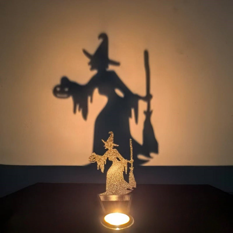 Broom witch Halloween shadow candle holder casting a flying witch and pumpkin silhouette on the wall